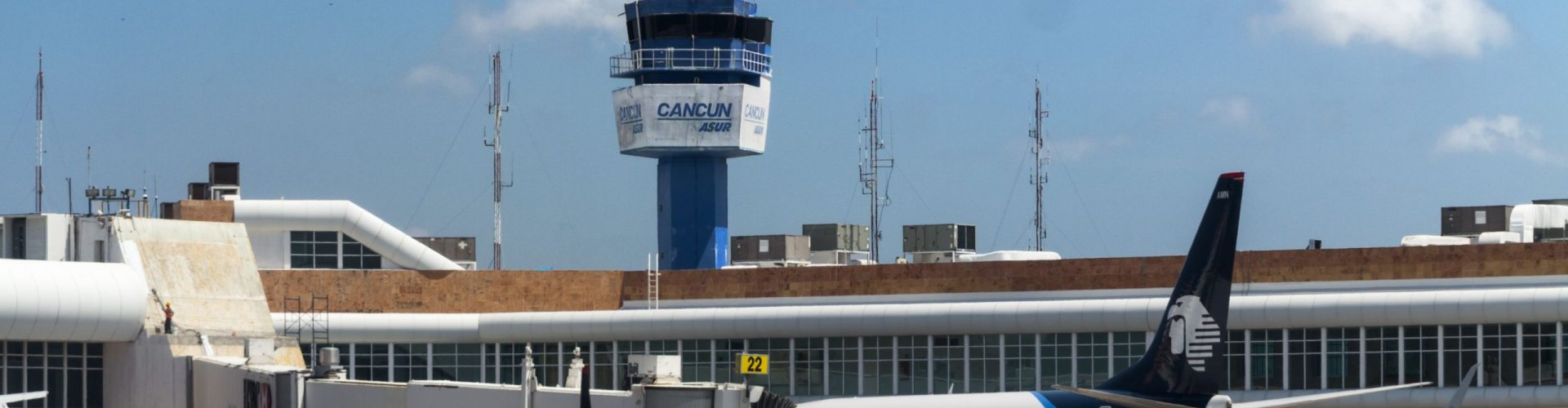 Runway-view sunset shot at Cancún Airport